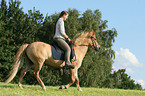 woman rides Icelandic horse