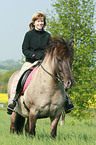 woman rides Icelandic horse